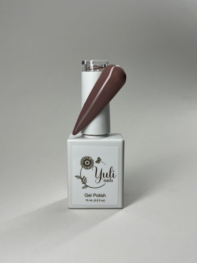 Gel nail polish in ‘Nude” shade by Yuli Nails Beauty. The vibrant blue color of the gel polish is rich and lustrous, creating a bold and glamorous look. The smooth and flawless application is achieved through the precision brush applicator with finely tapered bristles and an easy-to-grip handle. This gel polish offers long-lasting wear, chip resistance, and a high-gloss finish. Perfect for achieving professional salon-quality manicures at home.