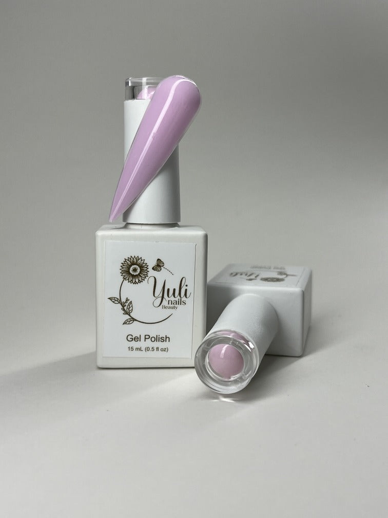 Gel nail polish in “Pink Yarn” shade by Yuli Nails Beauty. The vibrant blue color of the gel polish is rich and lustrous, creating a bold and glamorous look. The smooth and flawless application is achieved through the precision brush applicator with finely tapered bristles and an easy-to-grip handle. This gel polish offers long-lasting wear, chip resistance, and a high-gloss finish. Perfect for achieving professional salon-quality manicures at home.