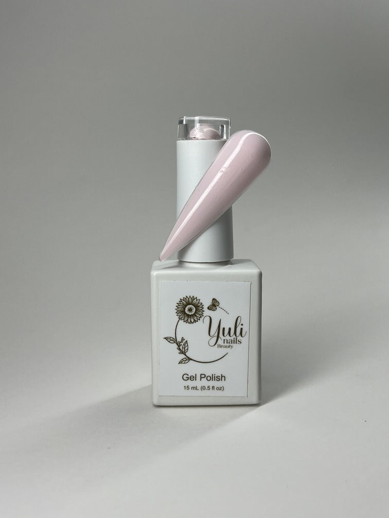 Gel nail polish in “Soft Pink” shade by Yuli Nails Beauty. The vibrant blue color of the gel polish is rich and lustrous, creating a bold and glamorous look. The smooth and flawless application is achieved through the precision brush applicator with finely tapered bristles and an easy-to-grip handle. This gel polish offers long-lasting wear, chip resistance, and a high-gloss finish. Perfect for achieving professional salon-quality manicures at home.